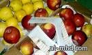 استخدام صفحات القرآن الكريم في تغليف الفاكهة